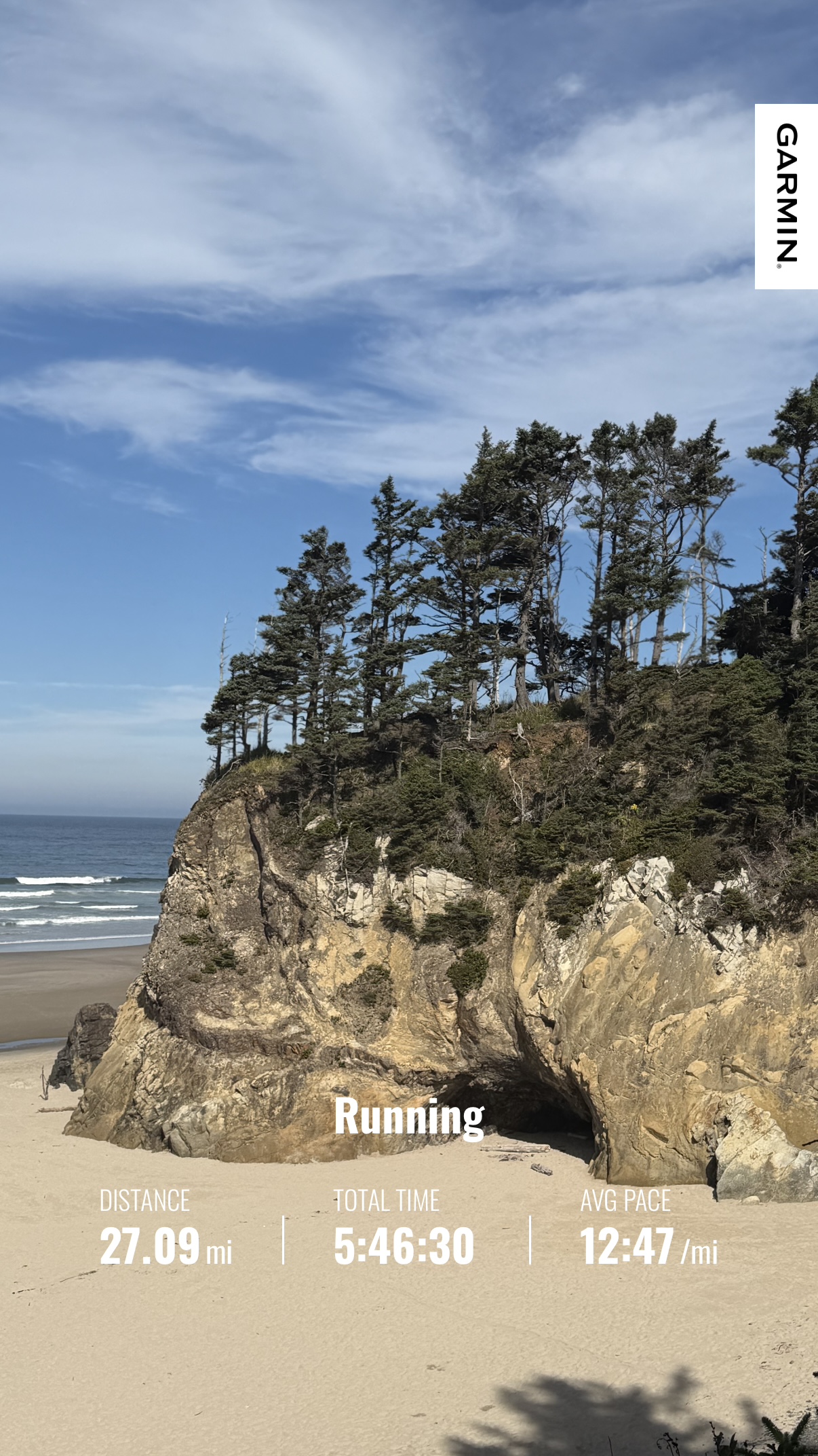 Coastal headland and sandy beach with Matthew’s Garmin summary showing a 27.09-mile run to Nehalem Bay