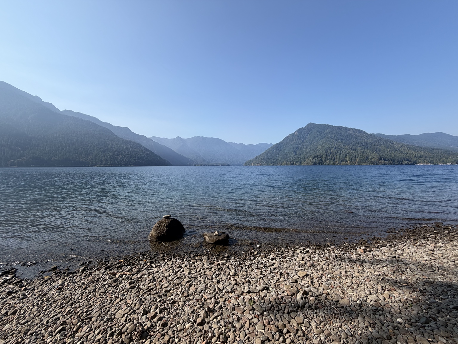 Lake Crescent and the Olympic Mountains viewed from a rocky shoreline