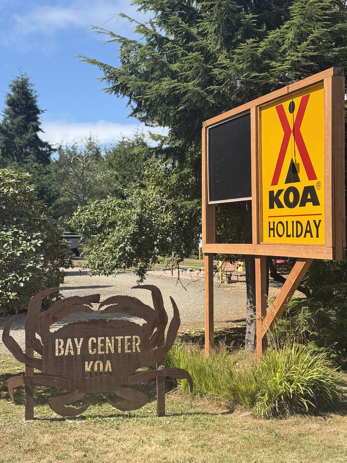 Bay Center KOA Holiday signs beside the road
