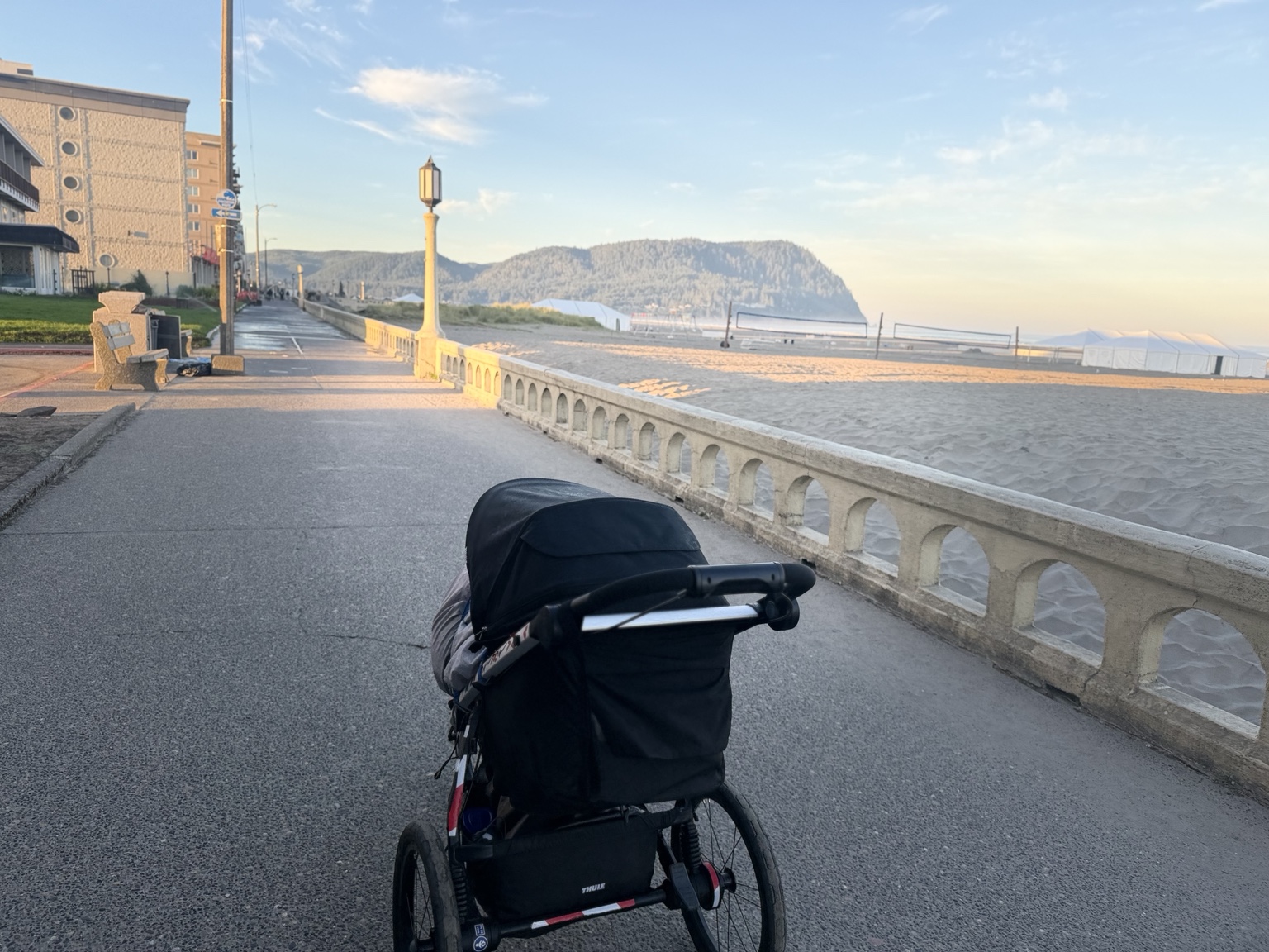Matthew’s running stroller on the Seaside Promenade beside the beach in the early morning light