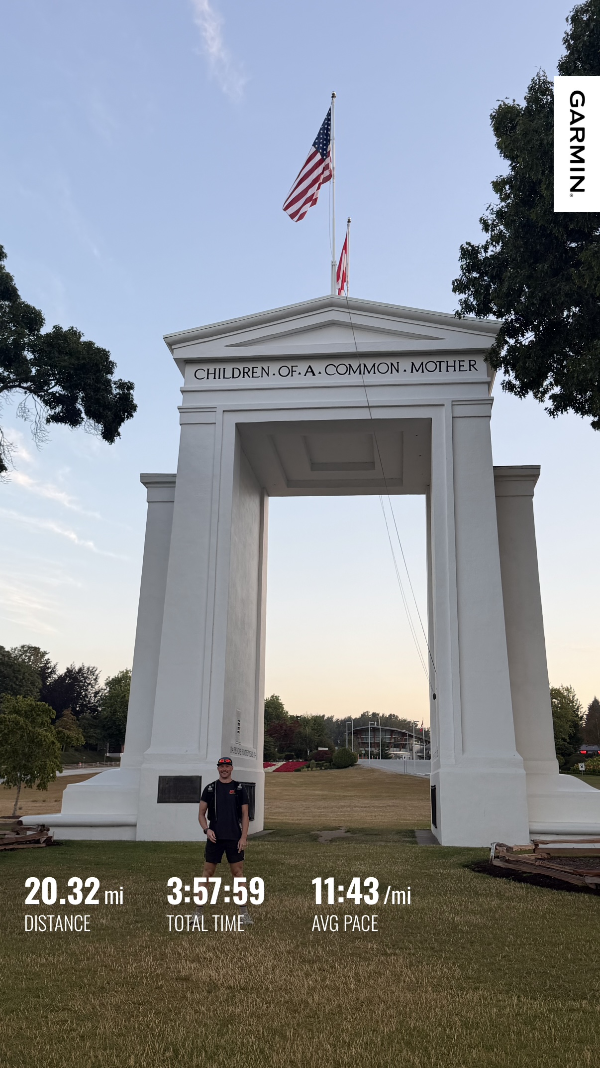Matthew beneath the Peace Arch after completing 20.32 miles on Day 1