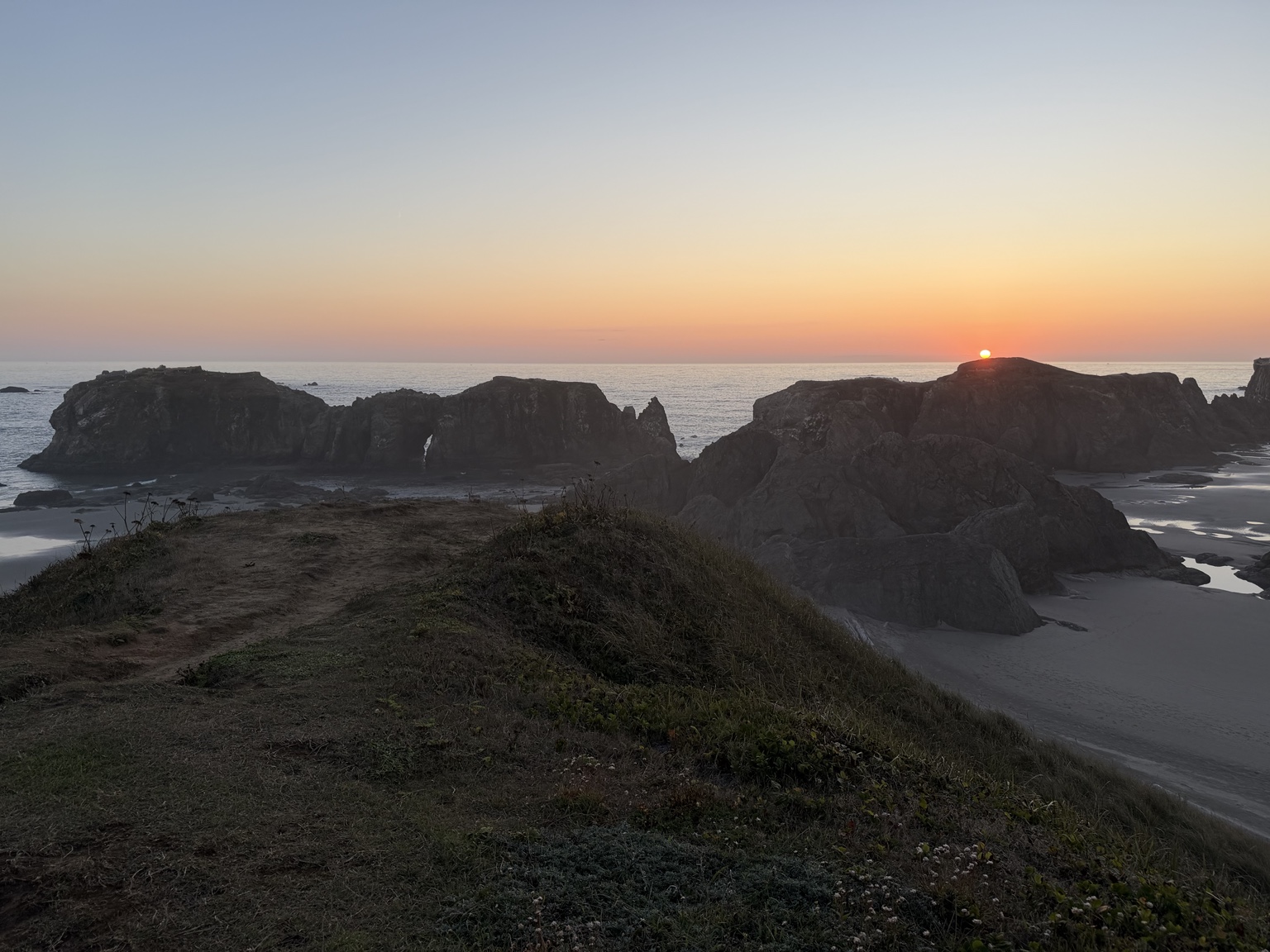 The sun setting across sea stacks and the Pacific Ocean near Bandon, Oregon