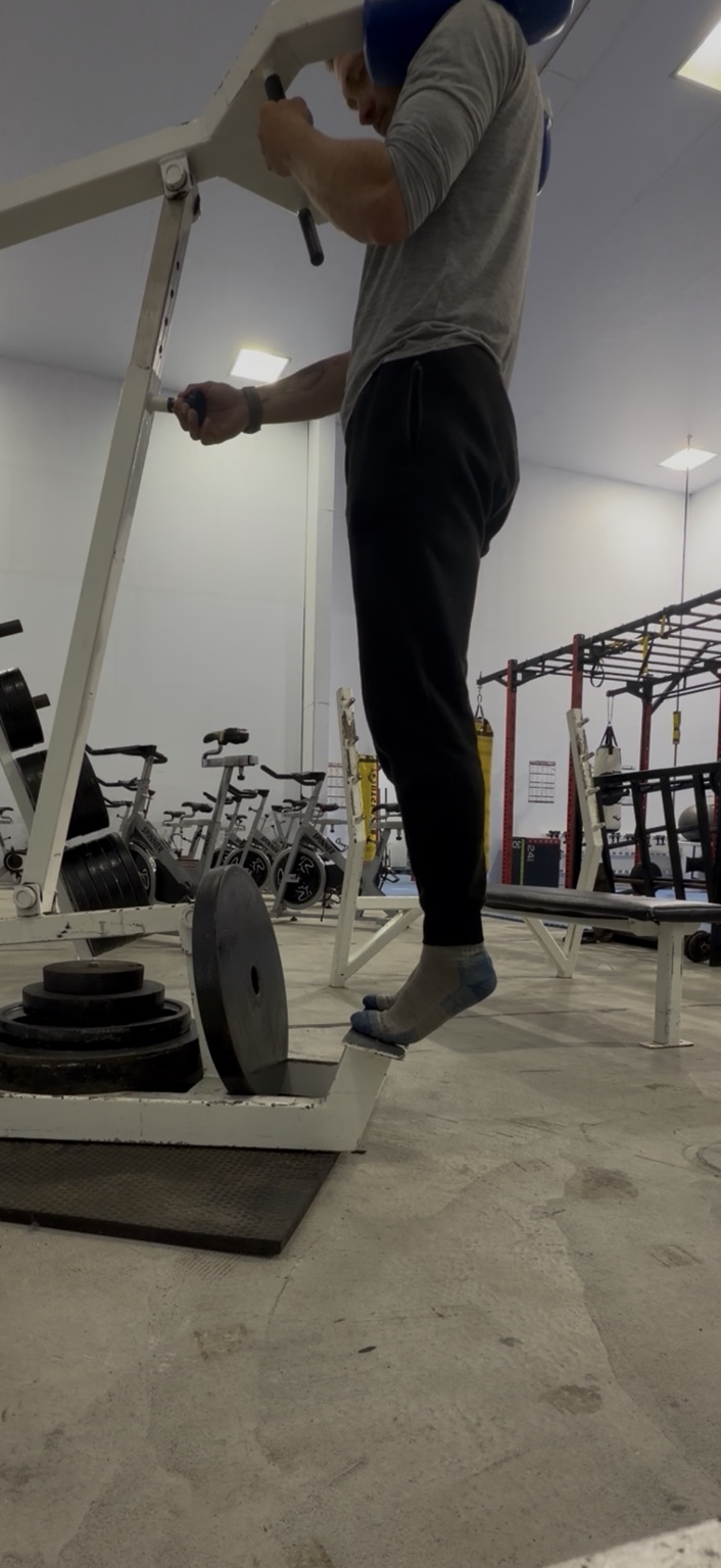 Matthew carefully performing calf raises during ankle rehabilitation